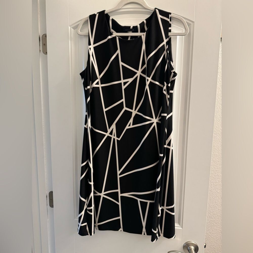 Black with white knee length sleeveless evening dress, barely worn size 12